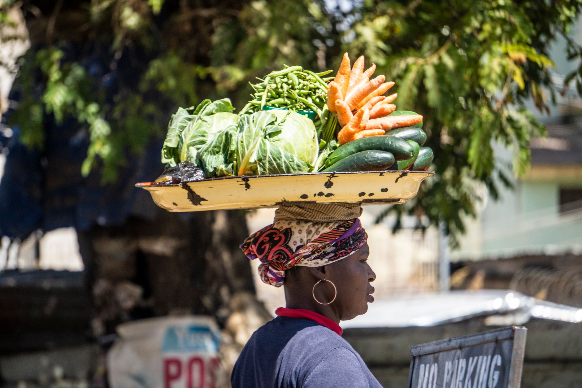 Woman selling fresh produce at a market